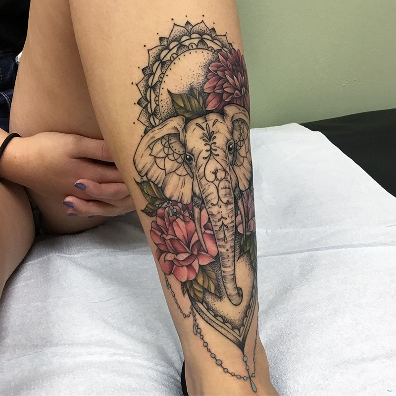 elephant dotwork tattoo with floral crown