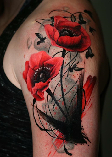 red poppy tattoo on arm